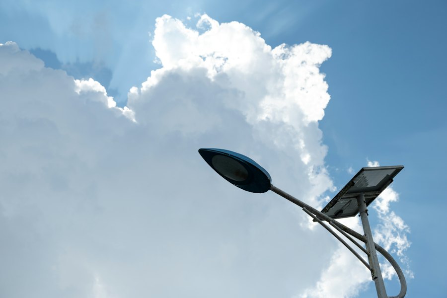 Solar street light with a solar panel against a blue sky